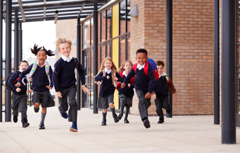 A photo of primary school aged children running