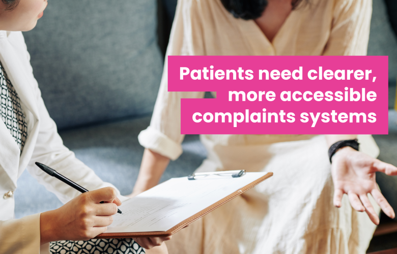 A photo of two women speaking, they are sat down and their faces are out of frame. One woman in professional clothes holds a clipboard and makes notes as the other speaks. Overlaid text reads 'patients need clearer more accessible complaints systems'