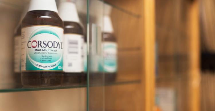A photo of a row of mouthwash on a shelf