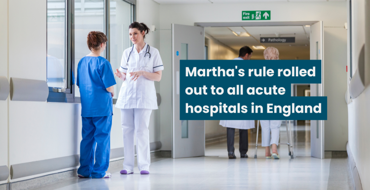 A photo of a hospital corridor with two medical staff speaking to each other. Text reads 'Martha's rule rolled out to all acut hospitals in England'