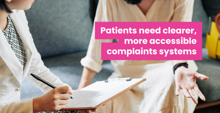 A photo of two women speaking, they are sat down and their faces are out of frame. One woman in professional clothes holds a clipboard and makes notes as the other speaks. Overlaid text reads 'patients need clearer more accessible complaints systems'