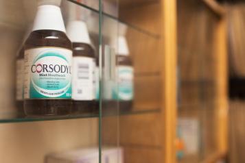A photo of a row of mouthwash on a shelf