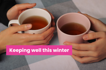 A photo of two mugs on a table with hands clasped around them. Text reads 'keeping well this winter'