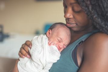 Picture of mother holding newborn 